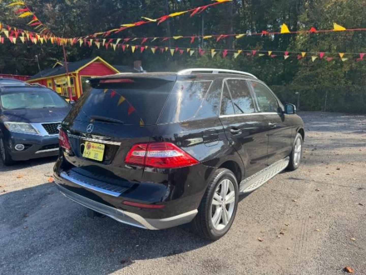 2014 Black Mercedes-Benz M-Class ML350 (4JGDA5JB5EA) with an 3.5L V6 DOHC 24V engine, 7-Speed Automatic transmission, located at 1806 Veterans Memorial Hwy SW, Austell, GA, 30168, (770) 944-9558, 33.817959, -84.606987 - Photo#3