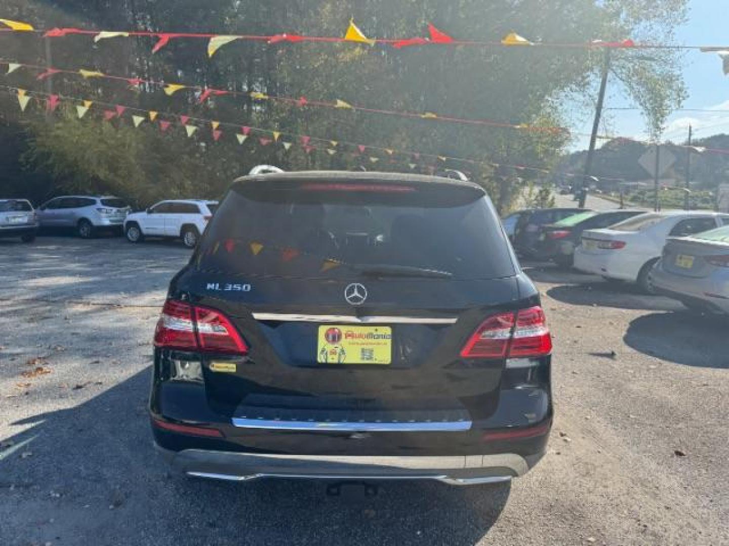 2014 Black Mercedes-Benz M-Class ML350 (4JGDA5JB5EA) with an 3.5L V6 DOHC 24V engine, 7-Speed Automatic transmission, located at 1806 Veterans Memorial Hwy SW, Austell, GA, 30168, (770) 944-9558, 33.817959, -84.606987 - Photo#4