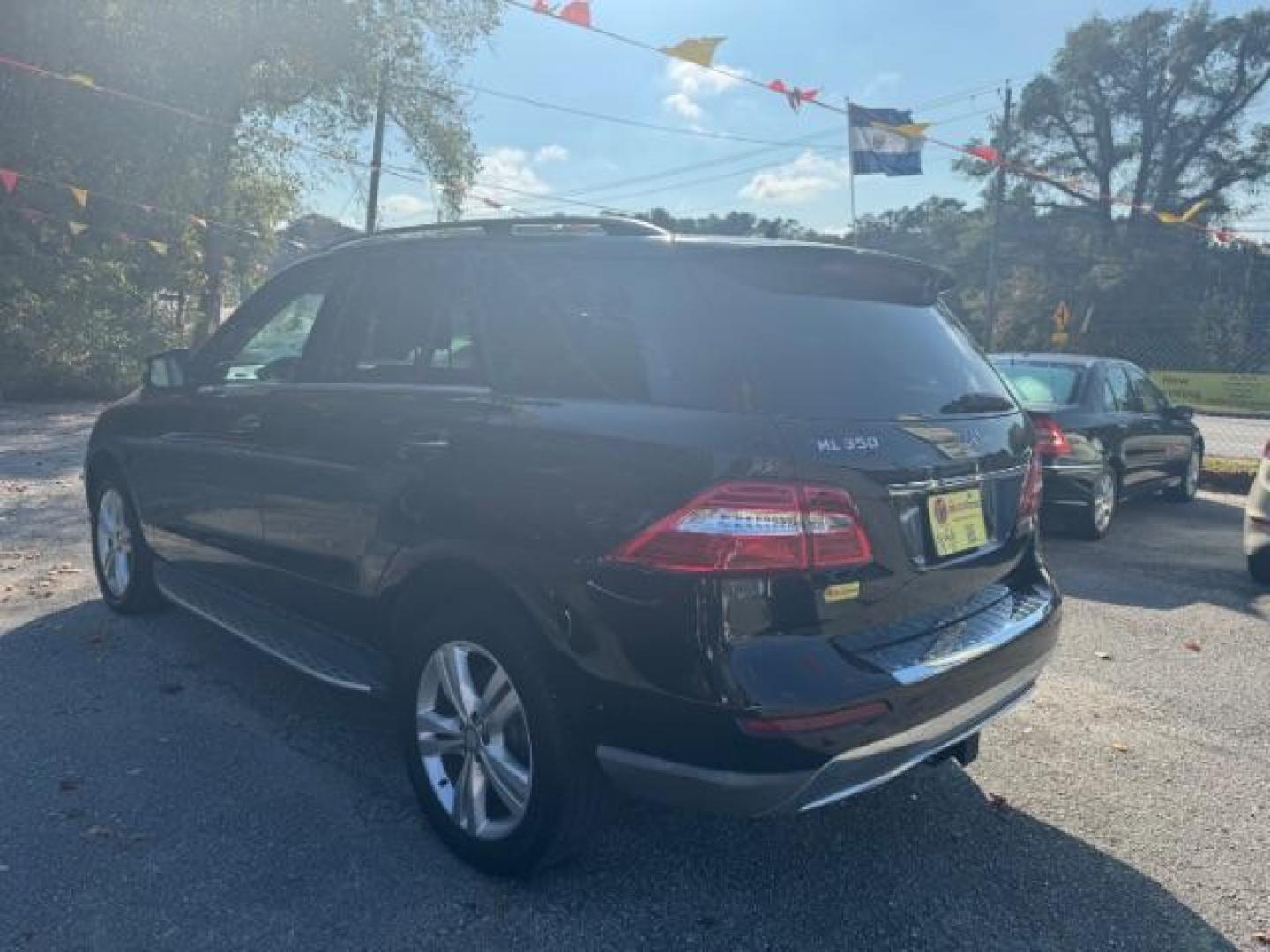 2014 Black Mercedes-Benz M-Class ML350 (4JGDA5JB5EA) with an 3.5L V6 DOHC 24V engine, 7-Speed Automatic transmission, located at 1806 Veterans Memorial Hwy SW, Austell, GA, 30168, (770) 944-9558, 33.817959, -84.606987 - Photo#5