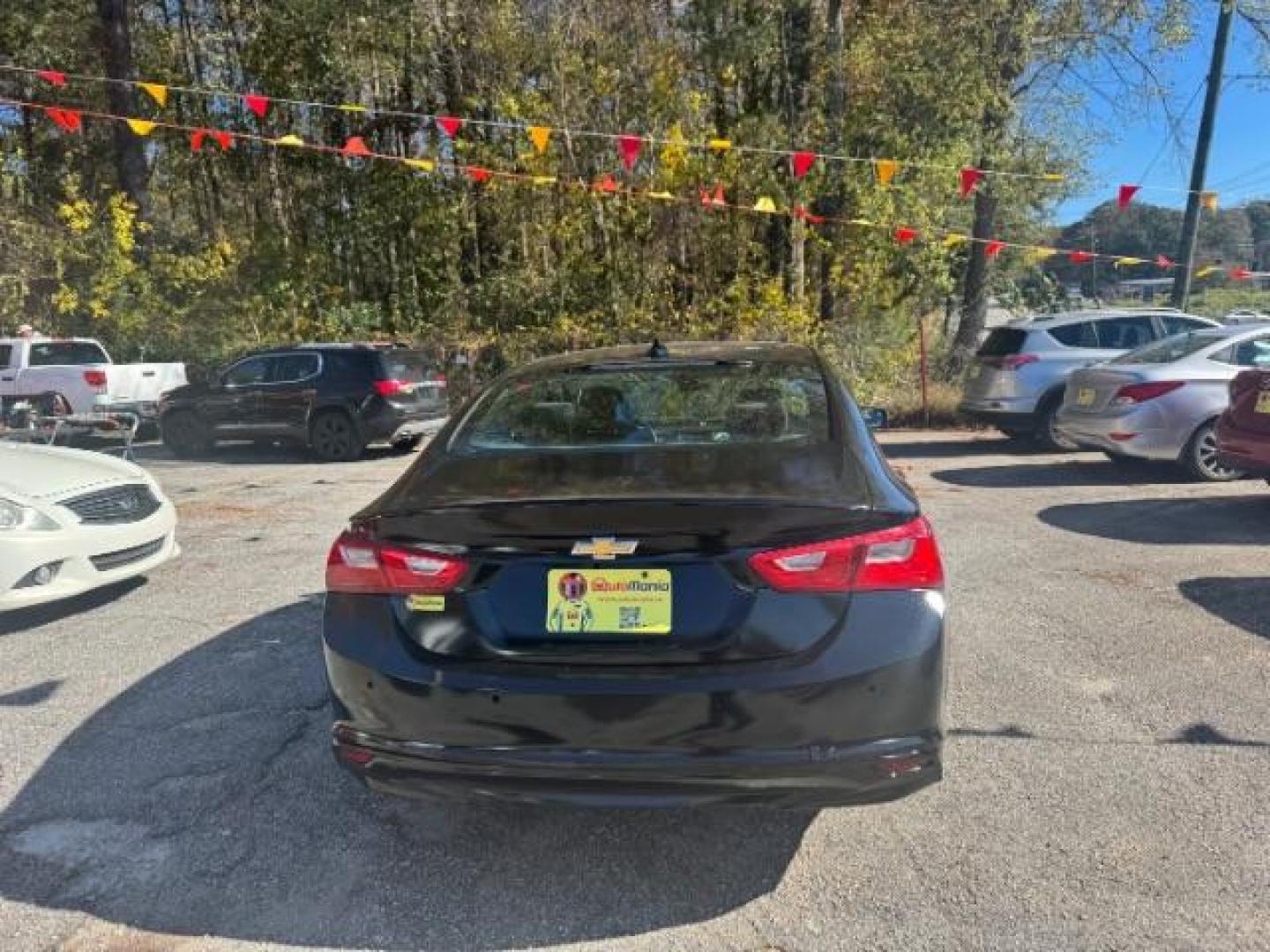 2017 Black Chevrolet Malibu LS (1G1ZB5ST0HF) with an 1.5L L4 DOHC 16V engine, 6-Speed Automatic transmission, located at 1806 Veterans Memorial Hwy SW, Austell, GA, 30168, (770) 944-9558, 33.817959, -84.606987 - Photo#4