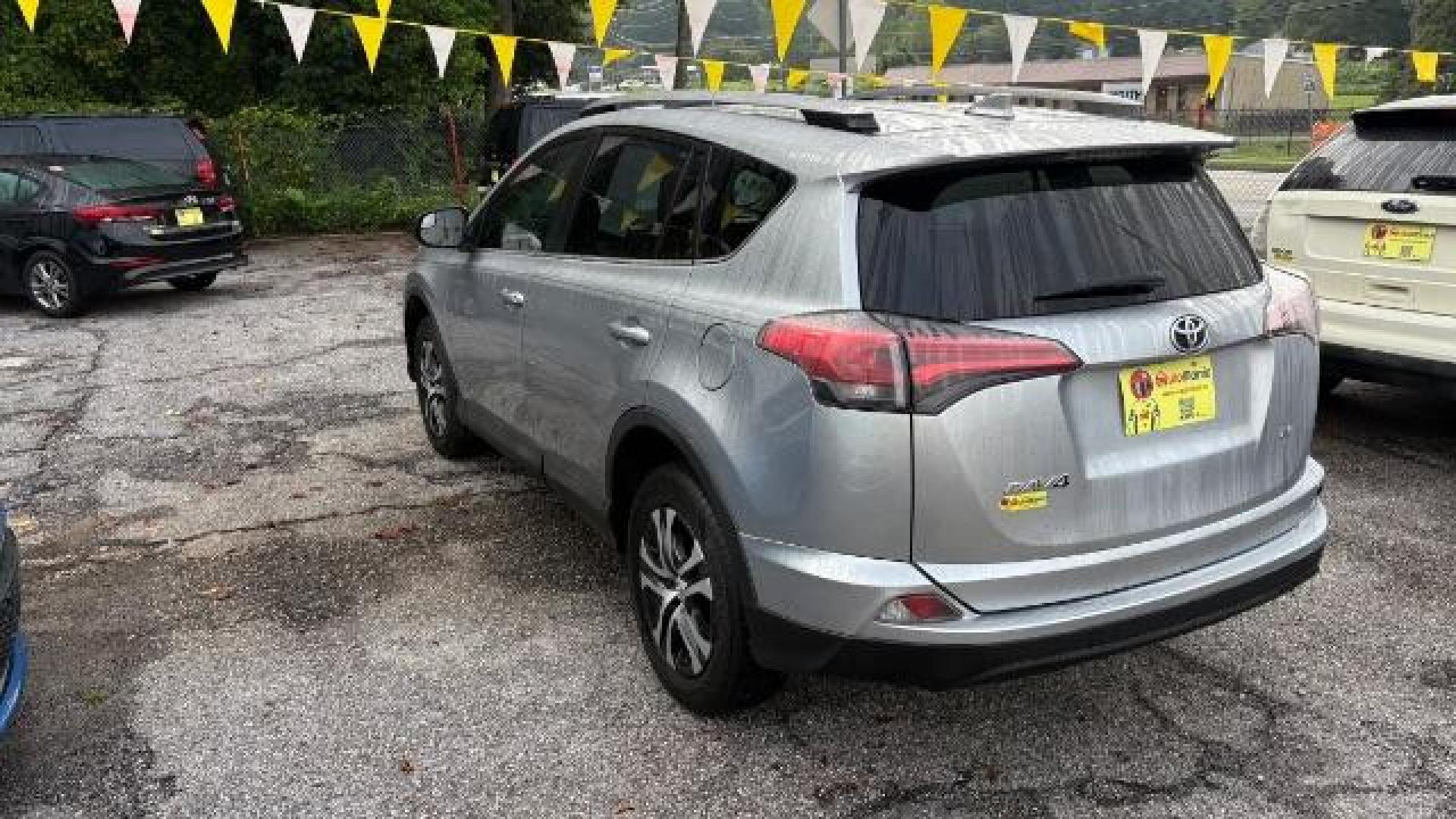 2018 Silver Toyota RAV4 LE FWD (2T3ZFREV3JW) with an 2.5L L4 DOHC 16V engine, 6-Speed Automatic transmission, located at 1806 Veterans Memorial Hwy SW, Austell, GA, 30168, (770) 944-9558, 33.817959, -84.606987 - Photo#3