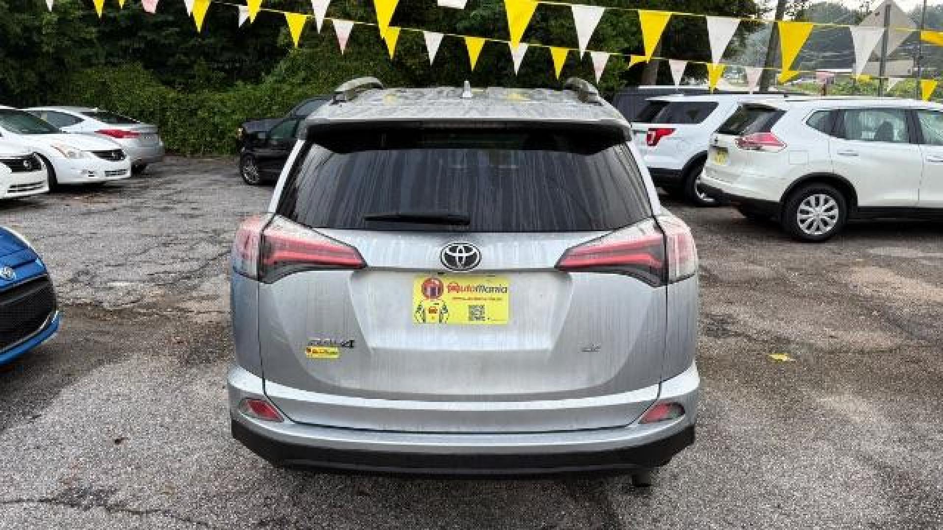 2018 Silver Toyota RAV4 LE FWD (2T3ZFREV3JW) with an 2.5L L4 DOHC 16V engine, 6-Speed Automatic transmission, located at 1806 Veterans Memorial Hwy SW, Austell, GA, 30168, (770) 944-9558, 33.817959, -84.606987 - Photo#4