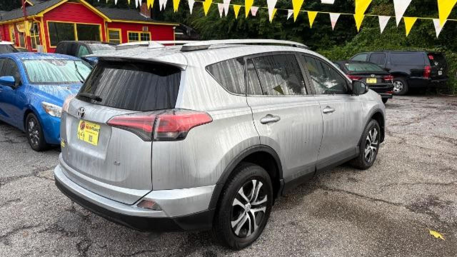 2018 Silver Toyota RAV4 LE FWD (2T3ZFREV3JW) with an 2.5L L4 DOHC 16V engine, 6-Speed Automatic transmission, located at 1806 Veterans Memorial Hwy SW, Austell, GA, 30168, (770) 944-9558, 33.817959, -84.606987 - Photo#5