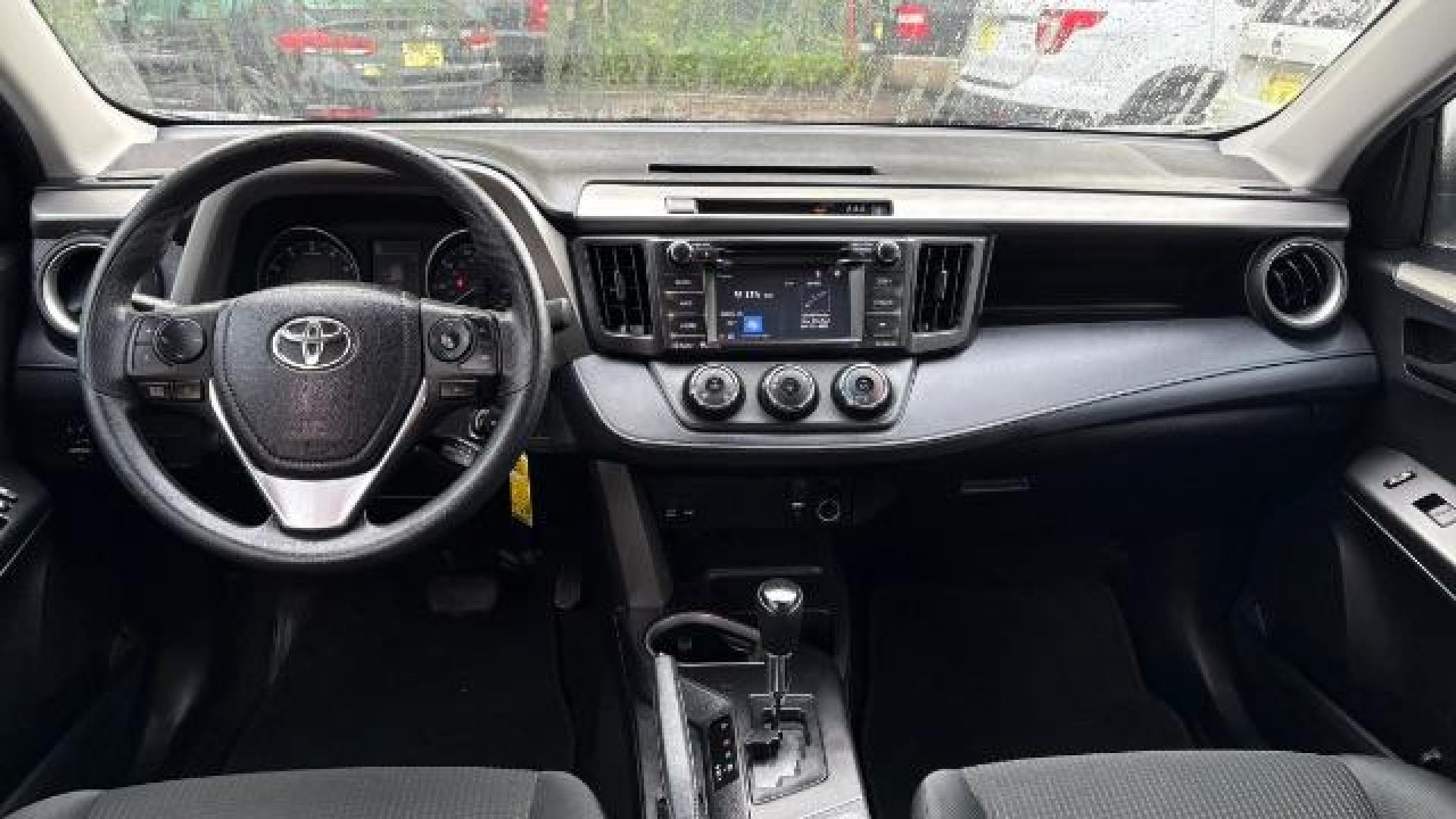 2018 Silver Toyota RAV4 LE FWD (2T3ZFREV3JW) with an 2.5L L4 DOHC 16V engine, 6-Speed Automatic transmission, located at 1806 Veterans Memorial Hwy SW, Austell, GA, 30168, (770) 944-9558, 33.817959, -84.606987 - Photo#7