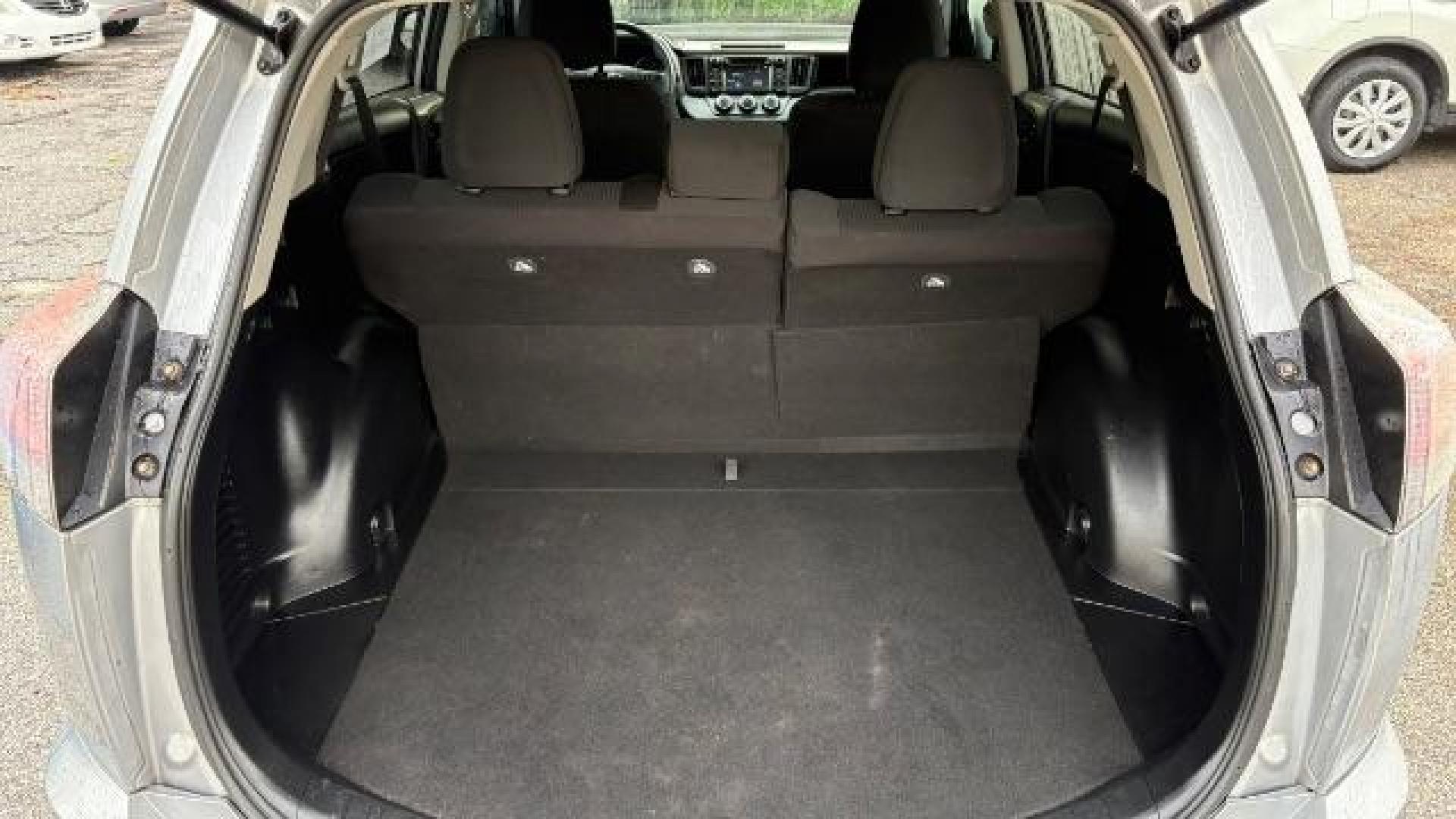 2018 Silver Toyota RAV4 LE FWD (2T3ZFREV3JW) with an 2.5L L4 DOHC 16V engine, 6-Speed Automatic transmission, located at 1806 Veterans Memorial Hwy SW, Austell, GA, 30168, (770) 944-9558, 33.817959, -84.606987 - Photo#12