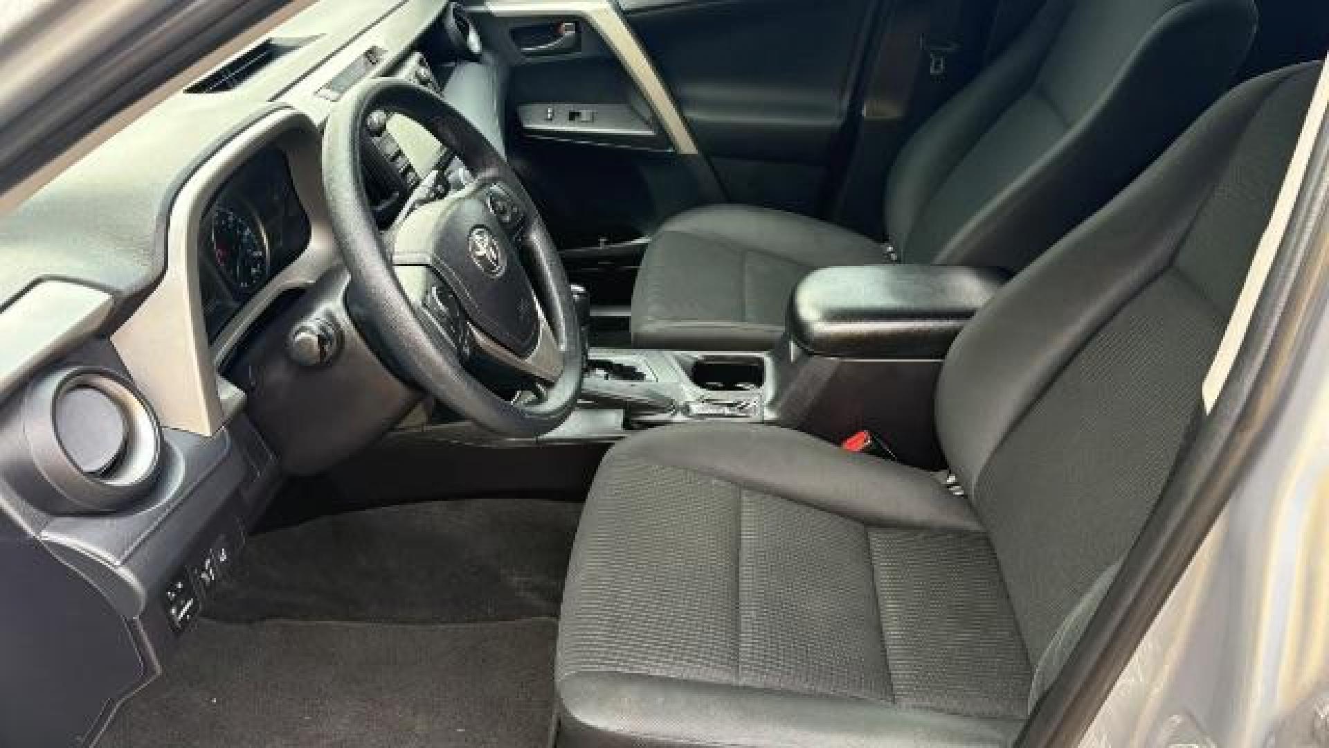 2018 Silver Toyota RAV4 LE FWD (2T3ZFREV3JW) with an 2.5L L4 DOHC 16V engine, 6-Speed Automatic transmission, located at 1806 Veterans Memorial Hwy SW, Austell, GA, 30168, (770) 944-9558, 33.817959, -84.606987 - Photo#14