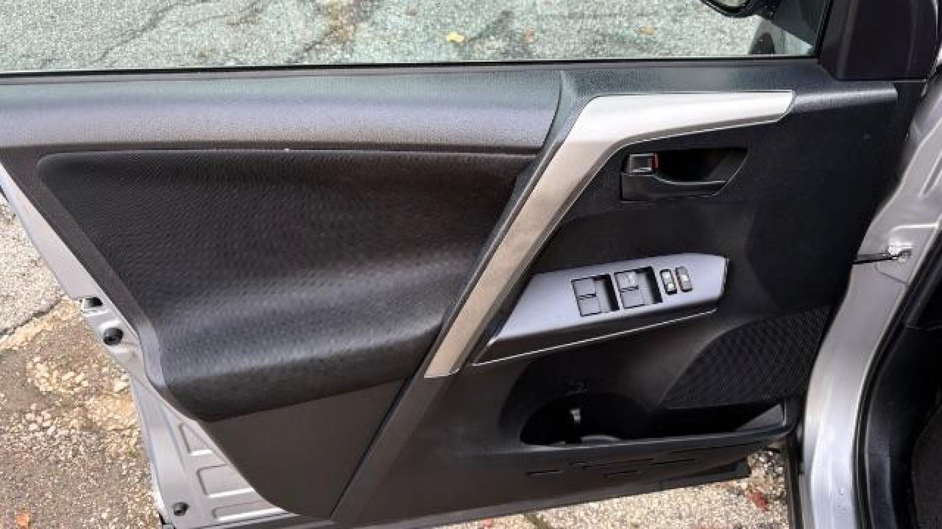 2018 Silver Toyota RAV4 LE FWD (2T3ZFREV3JW) with an 2.5L L4 DOHC 16V engine, 6-Speed Automatic transmission, located at 1806 Veterans Memorial Hwy SW, Austell, GA, 30168, (770) 944-9558, 33.817959, -84.606987 - Photo#16