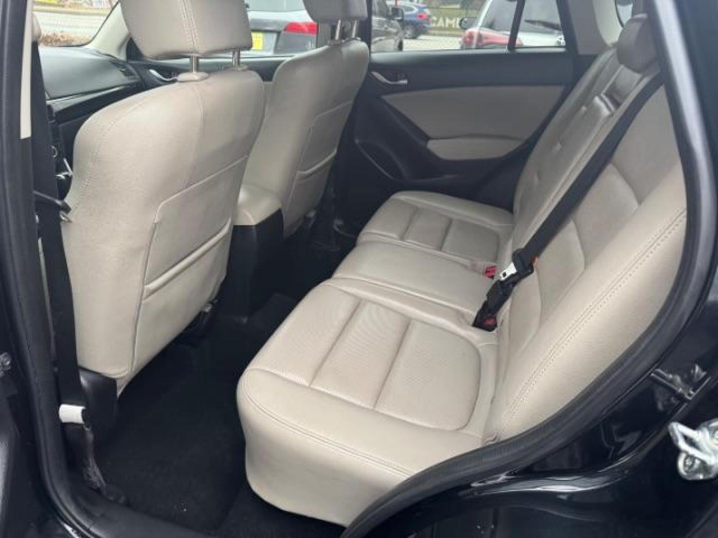 2015 Black Mazda CX-5 Grand Touring AWD (JM3KE4DY3F0) with an 2.5L L4 DOHC 16V engine, 6-Speed Automatic transmission, located at 1806 Veterans Memorial Hwy SW, Austell, GA, 30168, (770) 944-9558, 33.817959, -84.606987 - Photo#9