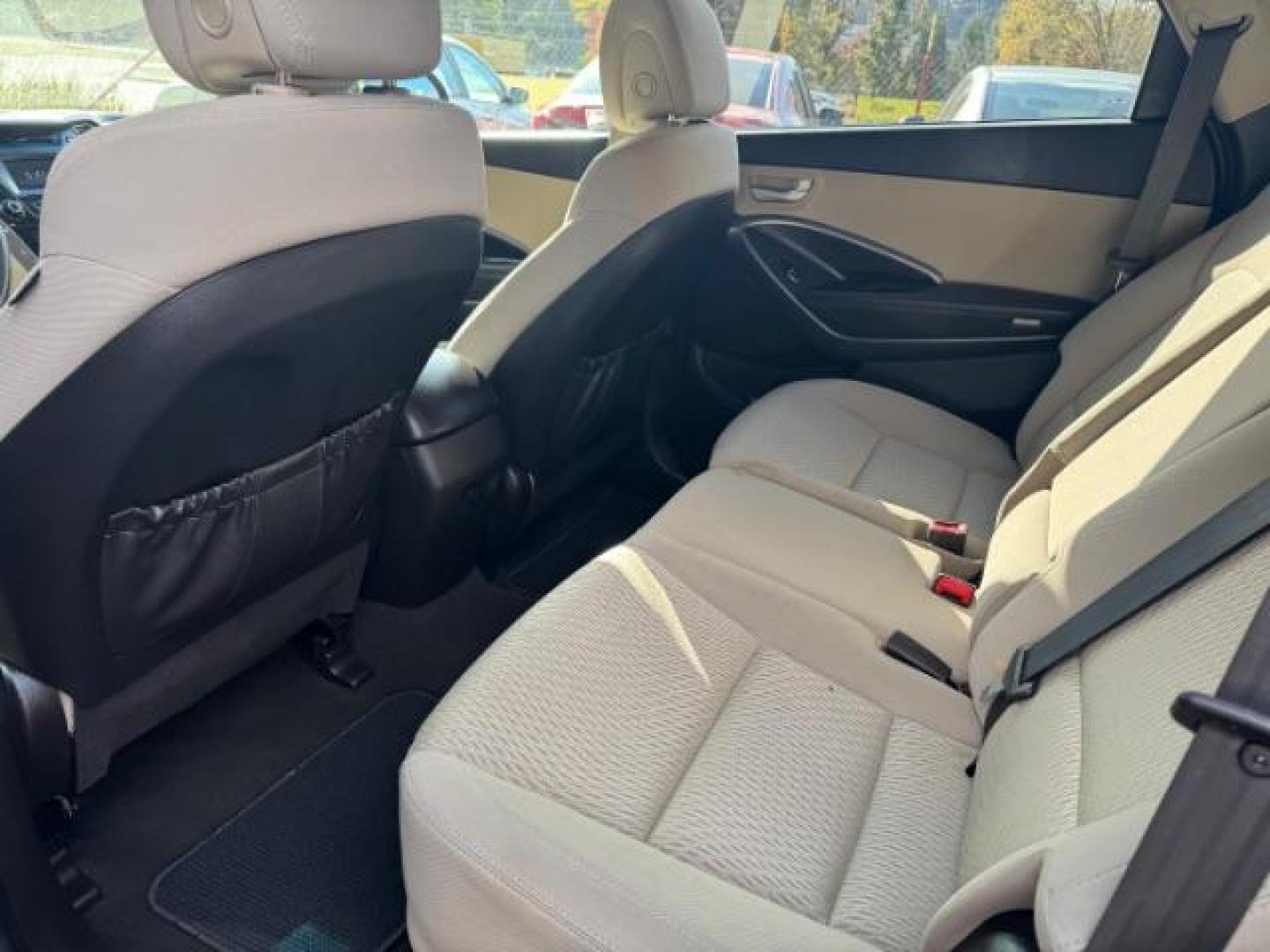 2016 Blue Hyundai Santa Fe SE AWD (KM8SMDHF4GU) with an 3.3L V6 DOHC 24V engine, 6-Speed Automatic transmission, located at 1806 Veterans Memorial Hwy SW, Austell, GA, 30168, (770) 944-9558, 33.817959, -84.606987 - Photo#8