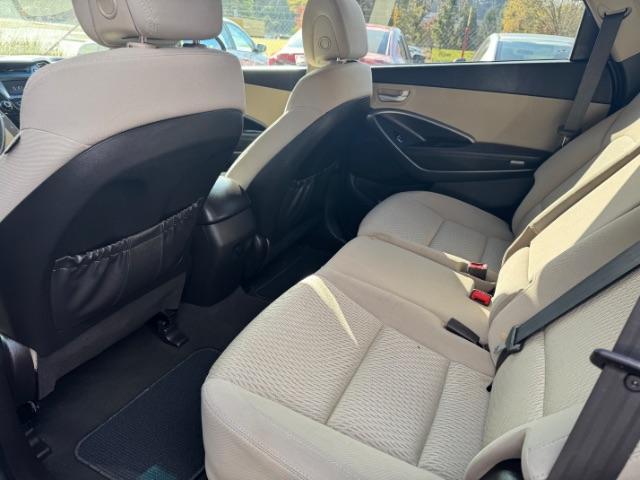 2016 Blue Hyundai Santa Fe SE AWD (KM8SMDHF4GU) with an 3.3L V6 DOHC 24V engine, 6-Speed Automatic transmission, located at 1806 Veterans Memorial Hwy SW, Austell, GA, 30168, (770) 944-9558, 33.817959, -84.606987 - Photo#8