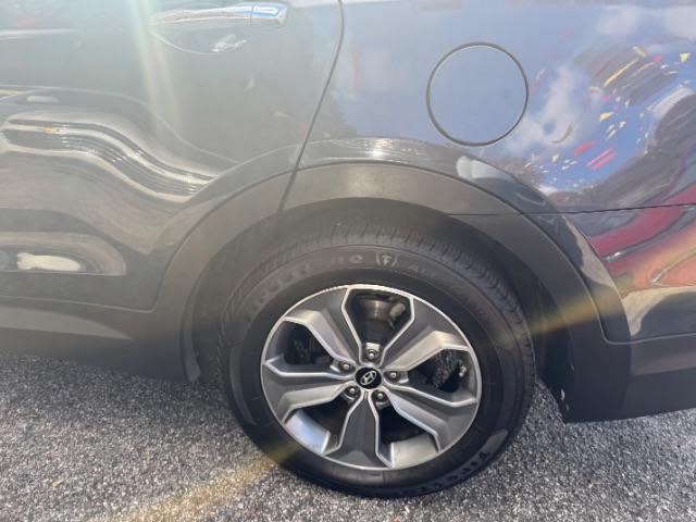 2016 Blue Hyundai Santa Fe SE AWD (KM8SMDHF4GU) with an 3.3L V6 DOHC 24V engine, 6-Speed Automatic transmission, located at 1806 Veterans Memorial Hwy SW, Austell, GA, 30168, (770) 944-9558, 33.817959, -84.606987 - Photo#20