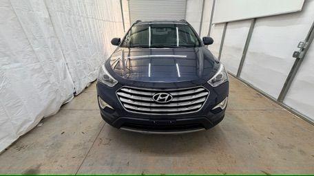 2016 Blue Hyundai Santa Fe SE AWD (KM8SMDHF4GU) with an 3.3L V6 DOHC 24V engine, 6-Speed Automatic transmission, located at 1806 Veterans Memorial Hwy SW, Austell, GA, 30168, (770) 944-9558, 33.817959, -84.606987 - Photo#9