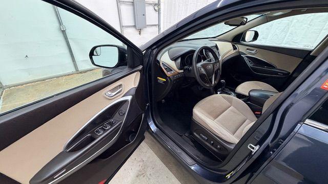 2016 Blue Hyundai Santa Fe SE AWD (KM8SMDHF4GU) with an 3.3L V6 DOHC 24V engine, 6-Speed Automatic transmission, located at 1806 Veterans Memorial Hwy SW, Austell, GA, 30168, (770) 944-9558, 33.817959, -84.606987 - Photo#11