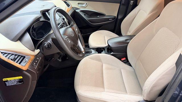 2016 Blue Hyundai Santa Fe SE AWD (KM8SMDHF4GU) with an 3.3L V6 DOHC 24V engine, 6-Speed Automatic transmission, located at 1806 Veterans Memorial Hwy SW, Austell, GA, 30168, (770) 944-9558, 33.817959, -84.606987 - Photo#12