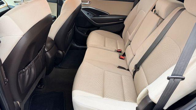 2016 Blue Hyundai Santa Fe SE AWD (KM8SMDHF4GU) with an 3.3L V6 DOHC 24V engine, 6-Speed Automatic transmission, located at 1806 Veterans Memorial Hwy SW, Austell, GA, 30168, (770) 944-9558, 33.817959, -84.606987 - Photo#14