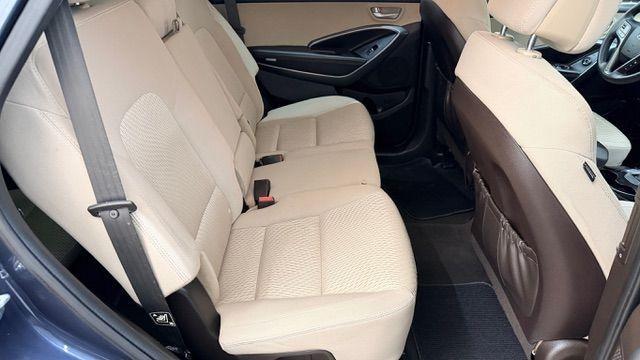 2016 Blue Hyundai Santa Fe SE AWD (KM8SMDHF4GU) with an 3.3L V6 DOHC 24V engine, 6-Speed Automatic transmission, located at 1806 Veterans Memorial Hwy SW, Austell, GA, 30168, (770) 944-9558, 33.817959, -84.606987 - Photo#17