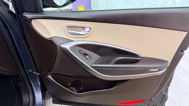 2016 Blue Hyundai Santa Fe SE AWD (KM8SMDHF4GU) with an 3.3L V6 DOHC 24V engine, 6-Speed Automatic transmission, located at 1806 Veterans Memorial Hwy SW, Austell, GA, 30168, (770) 944-9558, 33.817959, -84.606987 - Photo#18