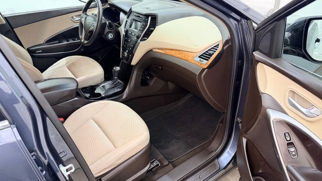 2016 Blue Hyundai Santa Fe SE AWD (KM8SMDHF4GU) with an 3.3L V6 DOHC 24V engine, 6-Speed Automatic transmission, located at 1806 Veterans Memorial Hwy SW, Austell, GA, 30168, (770) 944-9558, 33.817959, -84.606987 - Photo#19