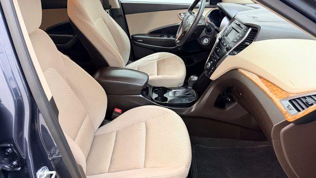 2016 Blue Hyundai Santa Fe SE AWD (KM8SMDHF4GU) with an 3.3L V6 DOHC 24V engine, 6-Speed Automatic transmission, located at 1806 Veterans Memorial Hwy SW, Austell, GA, 30168, (770) 944-9558, 33.817959, -84.606987 - Photo#20