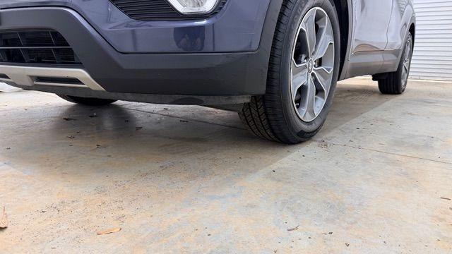 2016 Blue Hyundai Santa Fe SE AWD (KM8SMDHF4GU) with an 3.3L V6 DOHC 24V engine, 6-Speed Automatic transmission, located at 1806 Veterans Memorial Hwy SW, Austell, GA, 30168, (770) 944-9558, 33.817959, -84.606987 - Photo#22