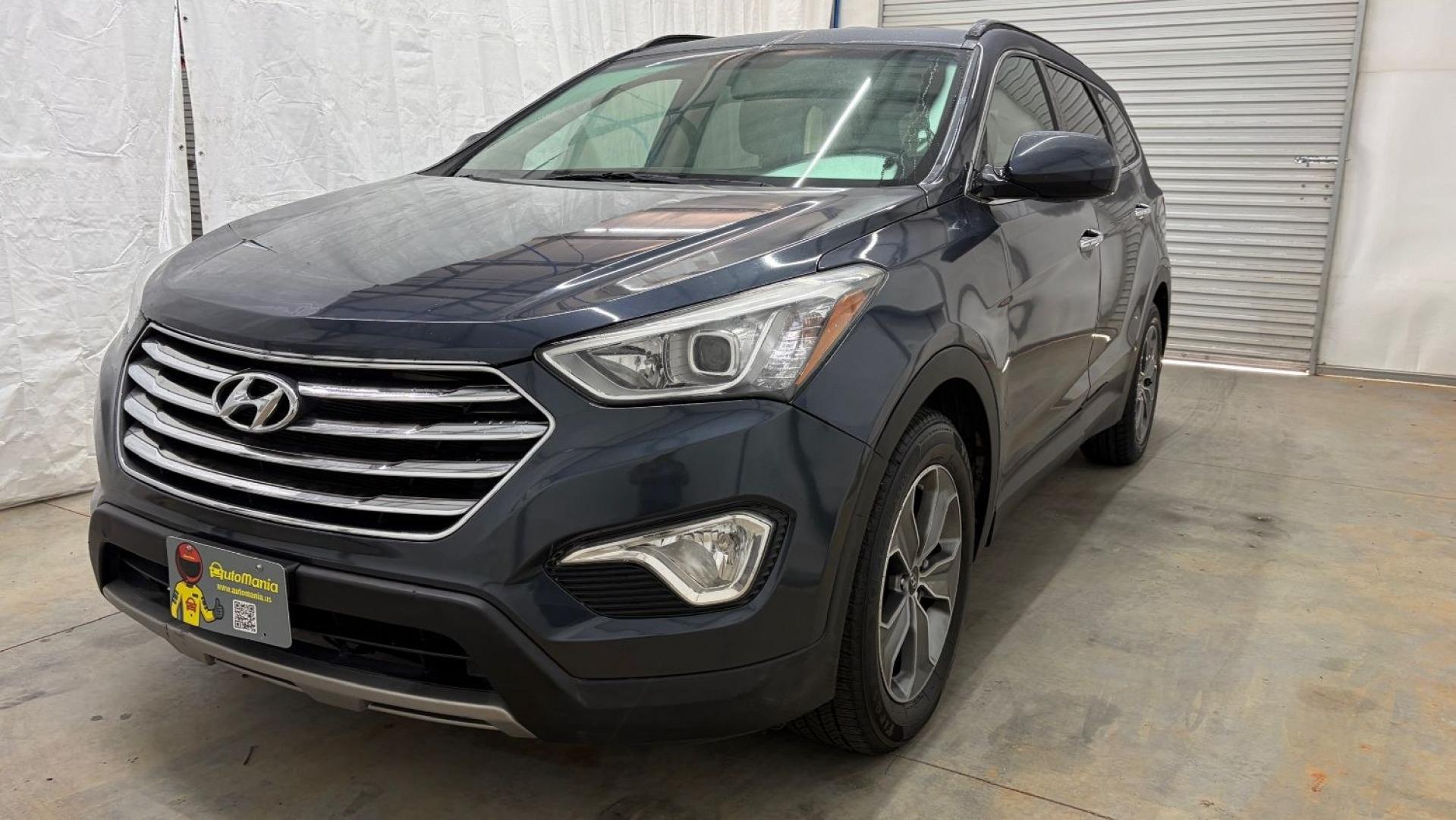 2016 Blue Hyundai Santa Fe SE AWD (KM8SMDHF4GU) with an 3.3L V6 DOHC 24V engine, 6-Speed Automatic transmission, located at 1806 Veterans Memorial Hwy SW, Austell, GA, 30168, (770) 944-9558, 33.817959, -84.606987 - This Santa Fe is in great shape overall. The exterior looks good with only minor scratches, and the tires look brand new. Inside, the seating is very comfortable. A roomy, practical SUV that's ready for daily driving.- Photo#0