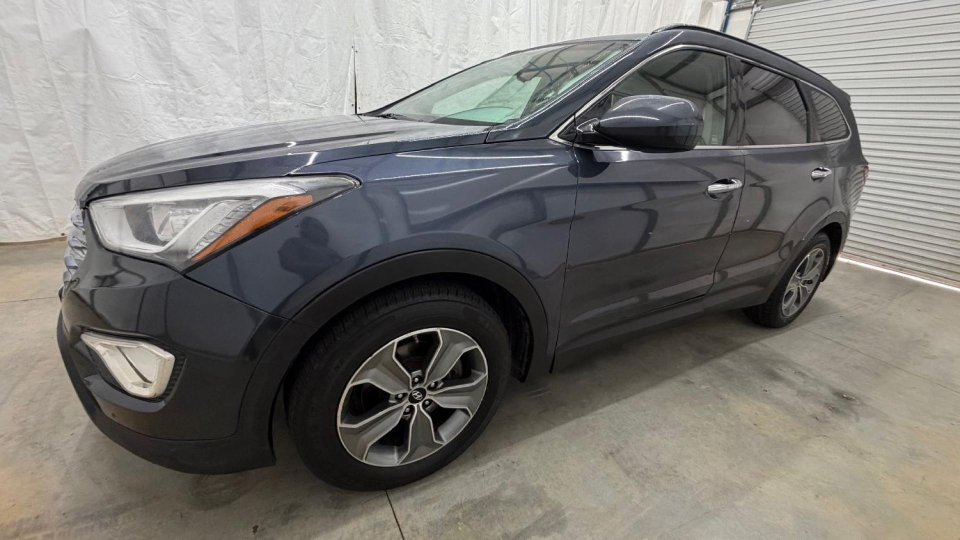 2016 Blue Hyundai Santa Fe SE AWD (KM8SMDHF4GU) with an 3.3L V6 DOHC 24V engine, 6-Speed Automatic transmission, located at 1806 Veterans Memorial Hwy SW, Austell, GA, 30168, (770) 944-9558, 33.817959, -84.606987 - This Santa Fe is in great shape overall. The exterior looks good with only minor scratches, and the tires look brand new. Inside, the seating is very comfortable. A roomy, practical SUV that's ready for daily driving.- Photo#1
