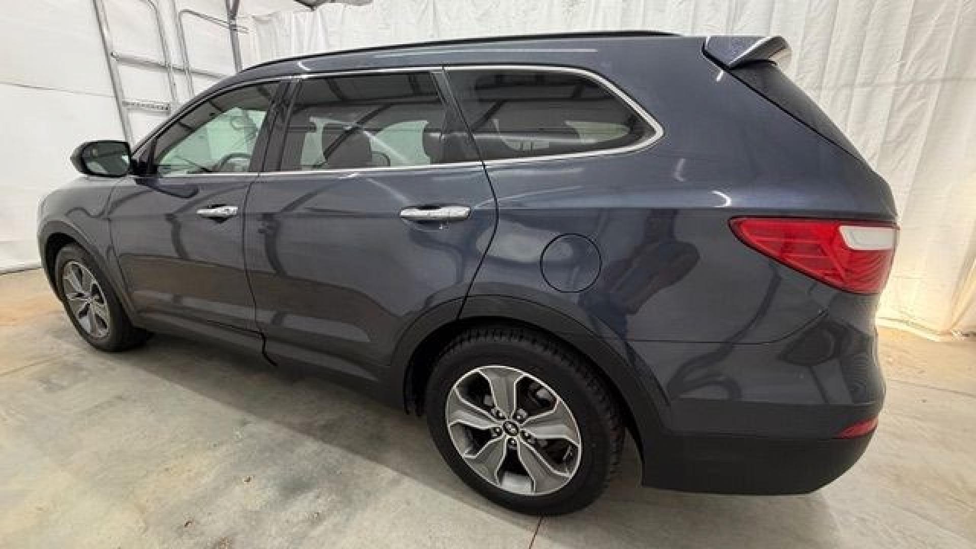 2016 Blue Hyundai Santa Fe SE AWD (KM8SMDHF4GU) with an 3.3L V6 DOHC 24V engine, 6-Speed Automatic transmission, located at 1806 Veterans Memorial Hwy SW, Austell, GA, 30168, (770) 944-9558, 33.817959, -84.606987 - This Santa Fe is in great shape overall. The exterior looks good with only minor scratches, and the tires look brand new. Inside, the seating is very comfortable. A roomy, practical SUV that's ready for daily driving.- Photo#2