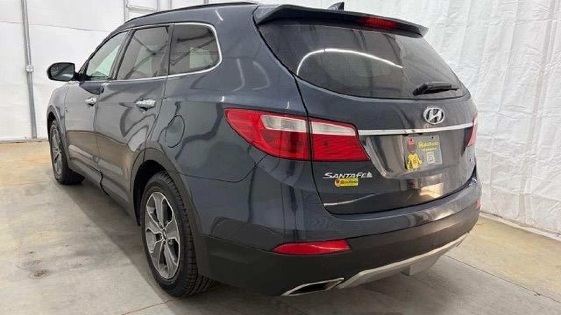 2016 Blue Hyundai Santa Fe SE AWD (KM8SMDHF4GU) with an 3.3L V6 DOHC 24V engine, 6-Speed Automatic transmission, located at 1806 Veterans Memorial Hwy SW, Austell, GA, 30168, (770) 944-9558, 33.817959, -84.606987 - This Santa Fe is in great shape overall. The exterior looks good with only minor scratches, and the tires look brand new. Inside, the seating is very comfortable. A roomy, practical SUV that's ready for daily driving.- Photo#3