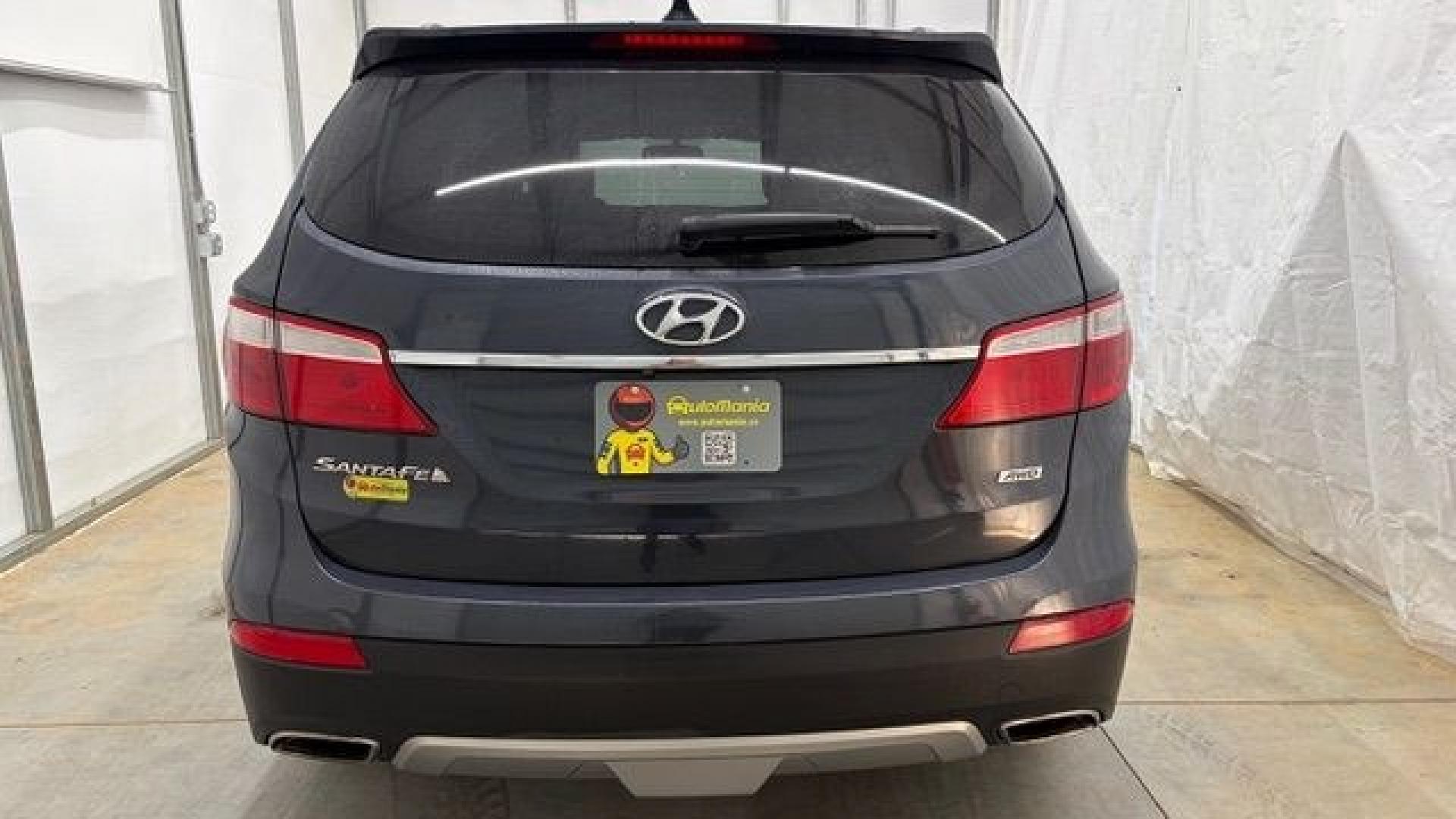 2016 Blue Hyundai Santa Fe SE AWD (KM8SMDHF4GU) with an 3.3L V6 DOHC 24V engine, 6-Speed Automatic transmission, located at 1806 Veterans Memorial Hwy SW, Austell, GA, 30168, (770) 944-9558, 33.817959, -84.606987 - This Santa Fe is in great shape overall. The exterior looks good with only minor scratches, and the tires look brand new. Inside, the seating is very comfortable. A roomy, practical SUV that's ready for daily driving.- Photo#4