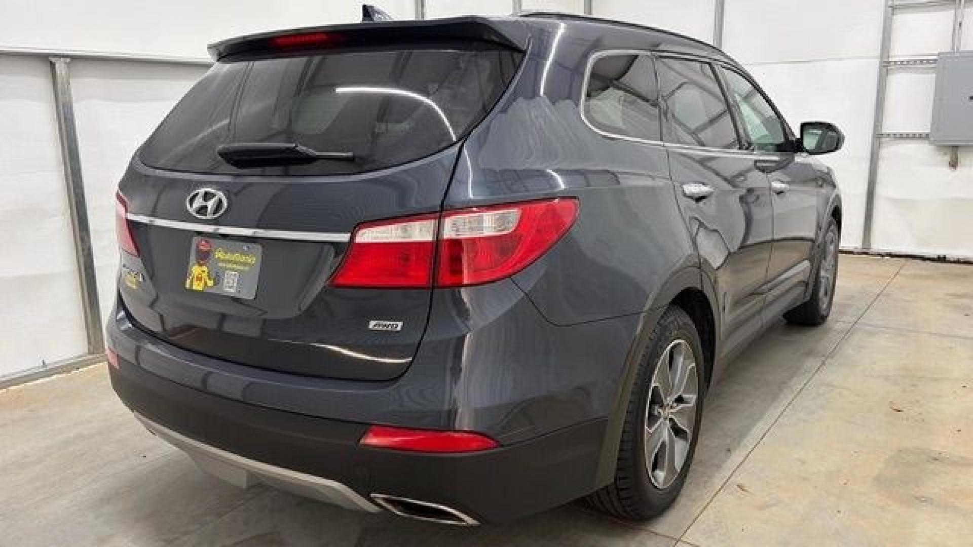 2016 Blue Hyundai Santa Fe SE AWD (KM8SMDHF4GU) with an 3.3L V6 DOHC 24V engine, 6-Speed Automatic transmission, located at 1806 Veterans Memorial Hwy SW, Austell, GA, 30168, (770) 944-9558, 33.817959, -84.606987 - This Santa Fe is in great shape overall. The exterior looks good with only minor scratches, and the tires look brand new. Inside, the seating is very comfortable. A roomy, practical SUV that's ready for daily driving.- Photo#6