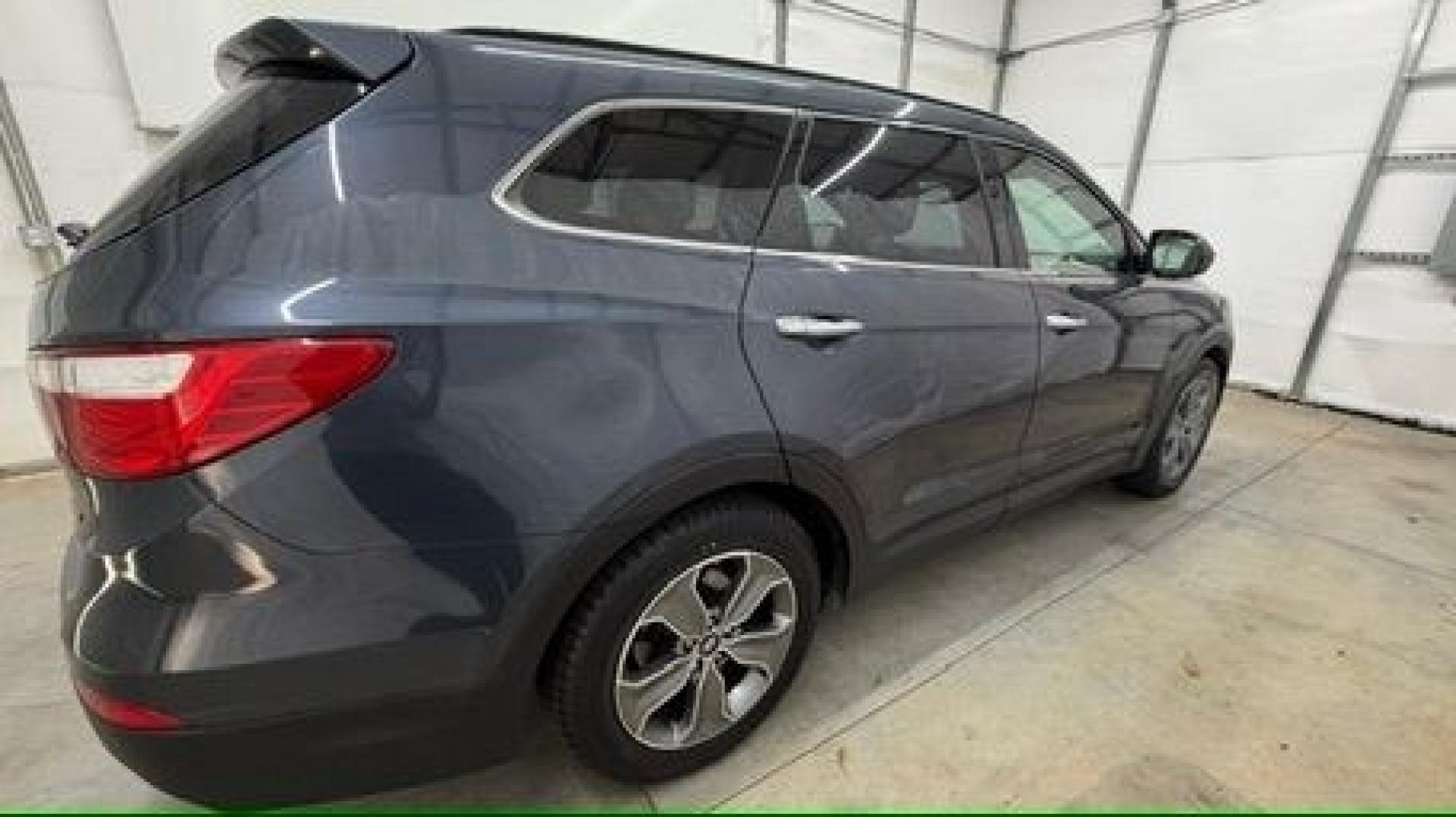 2016 Blue Hyundai Santa Fe SE AWD (KM8SMDHF4GU) with an 3.3L V6 DOHC 24V engine, 6-Speed Automatic transmission, located at 1806 Veterans Memorial Hwy SW, Austell, GA, 30168, (770) 944-9558, 33.817959, -84.606987 - This Santa Fe is in great shape overall. The exterior looks good with only minor scratches, and the tires look brand new. Inside, the seating is very comfortable. A roomy, practical SUV that's ready for daily driving.- Photo#7