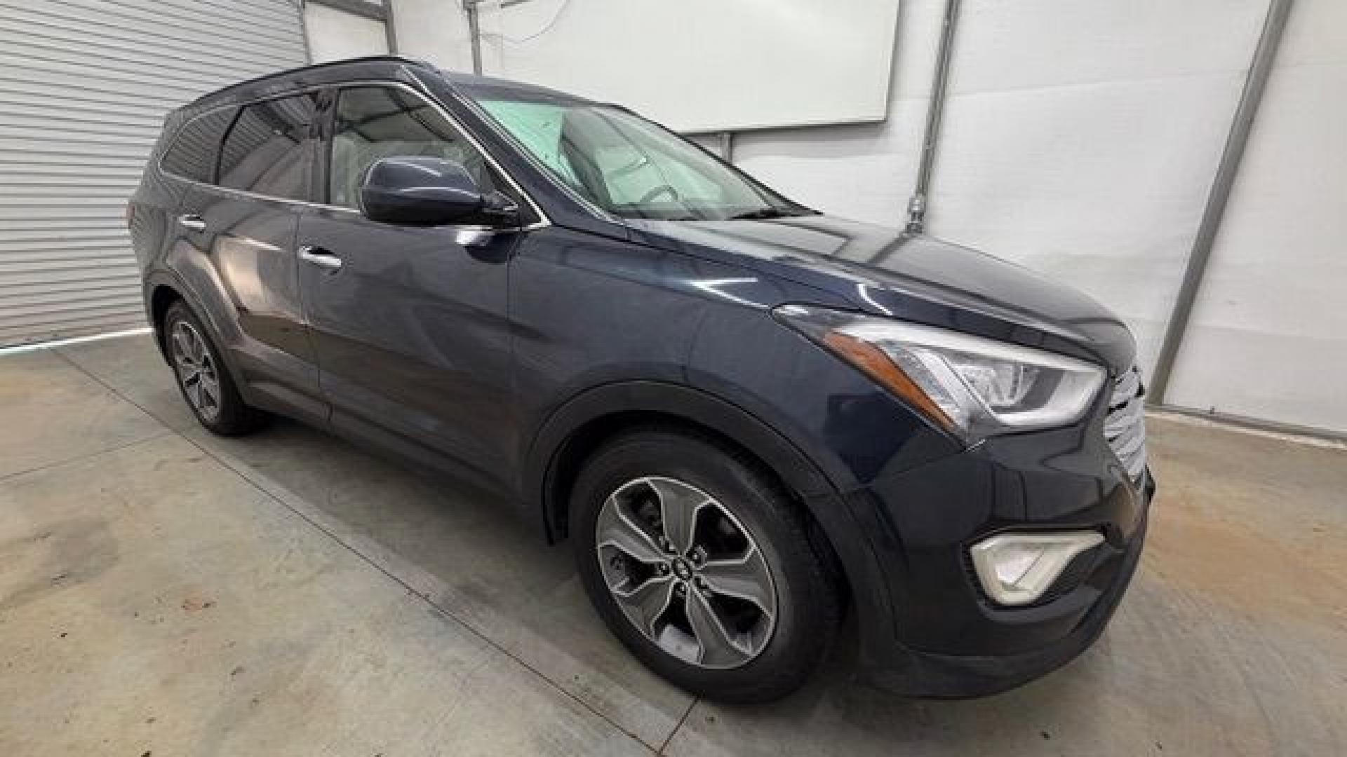 2016 Blue Hyundai Santa Fe SE AWD (KM8SMDHF4GU) with an 3.3L V6 DOHC 24V engine, 6-Speed Automatic transmission, located at 1806 Veterans Memorial Hwy SW, Austell, GA, 30168, (770) 944-9558, 33.817959, -84.606987 - This Santa Fe is in great shape overall. The exterior looks good with only minor scratches, and the tires look brand new. Inside, the seating is very comfortable. A roomy, practical SUV that's ready for daily driving.- Photo#8
