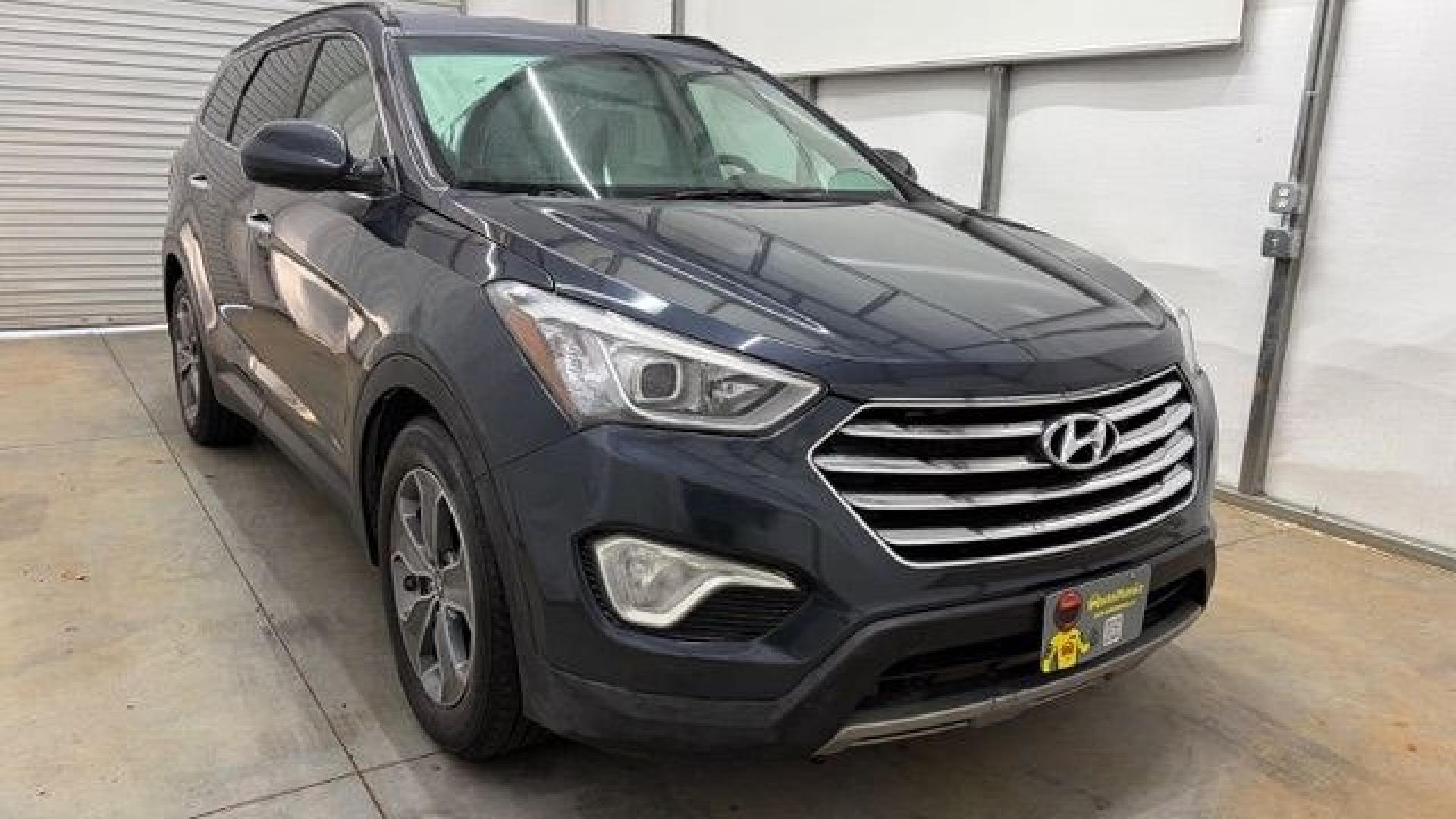 2016 Blue Hyundai Santa Fe SE AWD (KM8SMDHF4GU) with an 3.3L V6 DOHC 24V engine, 6-Speed Automatic transmission, located at 1806 Veterans Memorial Hwy SW, Austell, GA, 30168, (770) 944-9558, 33.817959, -84.606987 - This Santa Fe is in great shape overall. The exterior looks good with only minor scratches, and the tires look brand new. Inside, the seating is very comfortable. A roomy, practical SUV that's ready for daily driving.- Photo#9