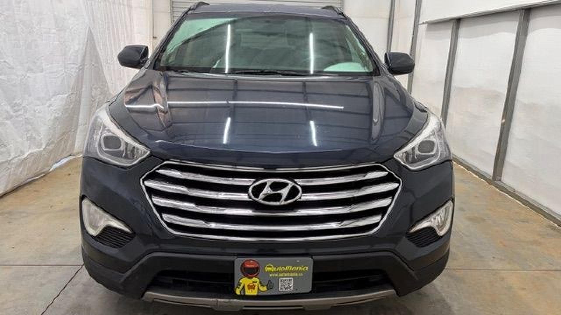 2016 Blue Hyundai Santa Fe SE AWD (KM8SMDHF4GU) with an 3.3L V6 DOHC 24V engine, 6-Speed Automatic transmission, located at 1806 Veterans Memorial Hwy SW, Austell, GA, 30168, (770) 944-9558, 33.817959, -84.606987 - This Santa Fe is in great shape overall. The exterior looks good with only minor scratches, and the tires look brand new. Inside, the seating is very comfortable. A roomy, practical SUV that's ready for daily driving.- Photo#10