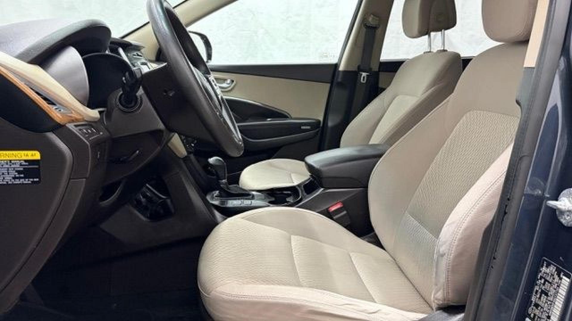 2016 Blue Hyundai Santa Fe SE AWD (KM8SMDHF4GU) with an 3.3L V6 DOHC 24V engine, 6-Speed Automatic transmission, located at 1806 Veterans Memorial Hwy SW, Austell, GA, 30168, (770) 944-9558, 33.817959, -84.606987 - This Santa Fe is in great shape overall. The exterior looks good with only minor scratches, and the tires look brand new. Inside, the seating is very comfortable. A roomy, practical SUV that's ready for daily driving.- Photo#12