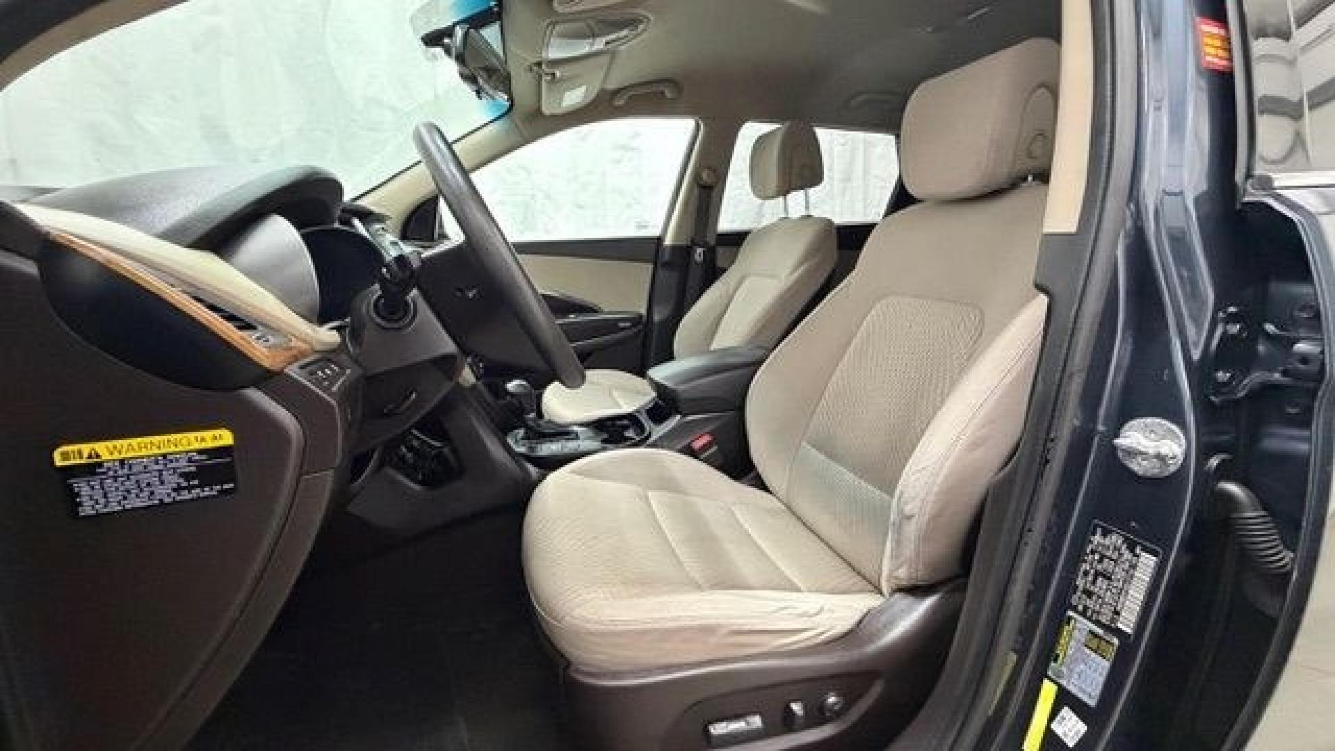 2016 Blue Hyundai Santa Fe SE AWD (KM8SMDHF4GU) with an 3.3L V6 DOHC 24V engine, 6-Speed Automatic transmission, located at 1806 Veterans Memorial Hwy SW, Austell, GA, 30168, (770) 944-9558, 33.817959, -84.606987 - This Santa Fe is in great shape overall. The exterior looks good with only minor scratches, and the tires look brand new. Inside, the seating is very comfortable. A roomy, practical SUV that's ready for daily driving.- Photo#13