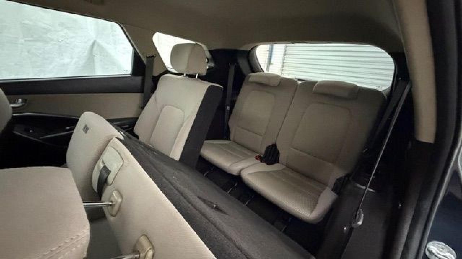 2016 Blue Hyundai Santa Fe SE AWD (KM8SMDHF4GU) with an 3.3L V6 DOHC 24V engine, 6-Speed Automatic transmission, located at 1806 Veterans Memorial Hwy SW, Austell, GA, 30168, (770) 944-9558, 33.817959, -84.606987 - This Santa Fe is in great shape overall. The exterior looks good with only minor scratches, and the tires look brand new. Inside, the seating is very comfortable. A roomy, practical SUV that's ready for daily driving.- Photo#16