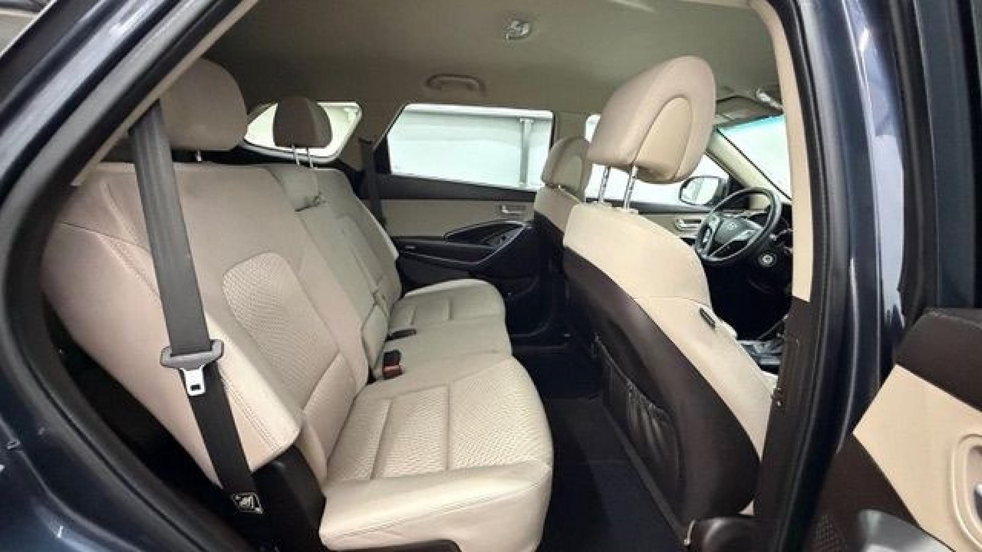 2016 Blue Hyundai Santa Fe SE AWD (KM8SMDHF4GU) with an 3.3L V6 DOHC 24V engine, 6-Speed Automatic transmission, located at 1806 Veterans Memorial Hwy SW, Austell, GA, 30168, (770) 944-9558, 33.817959, -84.606987 - This Santa Fe is in great shape overall. The exterior looks good with only minor scratches, and the tires look brand new. Inside, the seating is very comfortable. A roomy, practical SUV that's ready for daily driving.- Photo#17