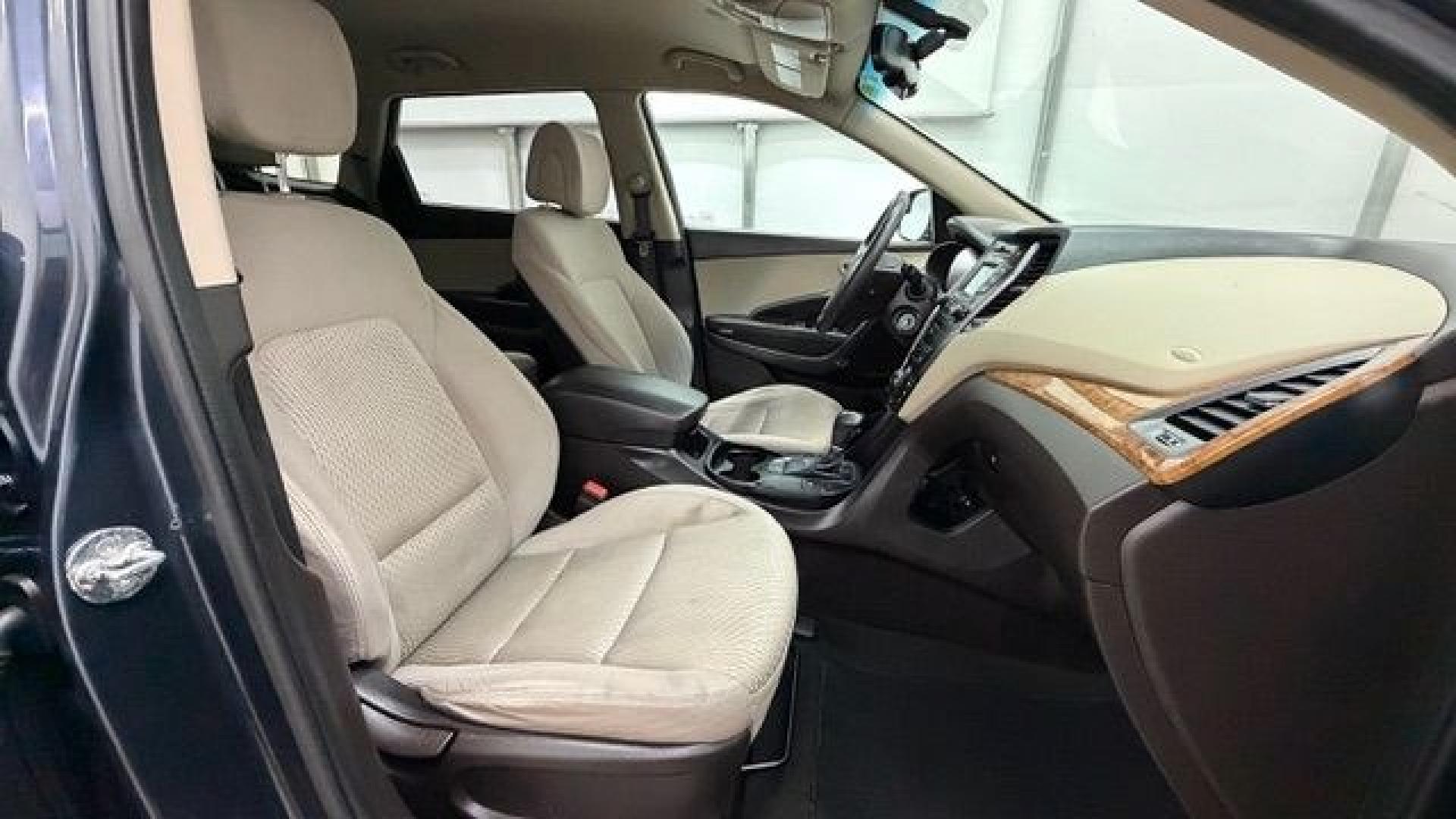 2016 Blue Hyundai Santa Fe SE AWD (KM8SMDHF4GU) with an 3.3L V6 DOHC 24V engine, 6-Speed Automatic transmission, located at 1806 Veterans Memorial Hwy SW, Austell, GA, 30168, (770) 944-9558, 33.817959, -84.606987 - This Santa Fe is in great shape overall. The exterior looks good with only minor scratches, and the tires look brand new. Inside, the seating is very comfortable. A roomy, practical SUV that's ready for daily driving.- Photo#18
