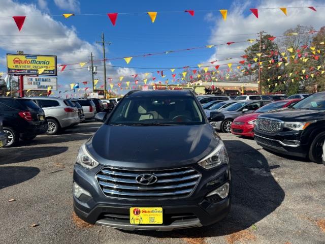 2016 Blue Hyundai Santa Fe SE AWD (KM8SMDHF4GU) with an 3.3L V6 DOHC 24V engine, 6-Speed Automatic transmission, located at 1806 Veterans Memorial Hwy SW, Austell, GA, 30168, (770) 944-9558, 33.817959, -84.606987 - Photo#0