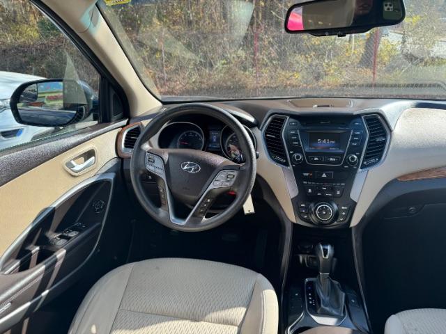 2016 Blue Hyundai Santa Fe SE AWD (KM8SMDHF4GU) with an 3.3L V6 DOHC 24V engine, 6-Speed Automatic transmission, located at 1806 Veterans Memorial Hwy SW, Austell, GA, 30168, (770) 944-9558, 33.817959, -84.606987 - Photo#11