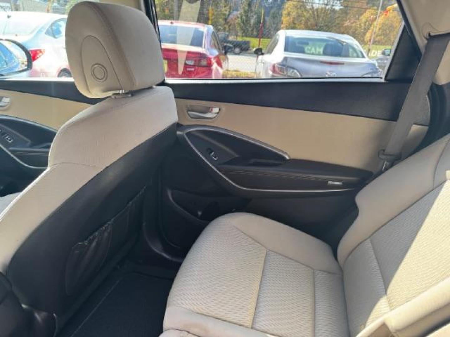 2016 Blue Hyundai Santa Fe SE AWD (KM8SMDHF4GU) with an 3.3L V6 DOHC 24V engine, 6-Speed Automatic transmission, located at 1806 Veterans Memorial Hwy SW, Austell, GA, 30168, (770) 944-9558, 33.817959, -84.606987 - Photo#16