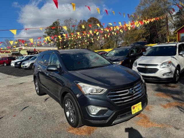 2016 Blue Hyundai Santa Fe SE AWD (KM8SMDHF4GU) with an 3.3L V6 DOHC 24V engine, 6-Speed Automatic transmission, located at 1806 Veterans Memorial Hwy SW, Austell, GA, 30168, (770) 944-9558, 33.817959, -84.606987 - Photo#1