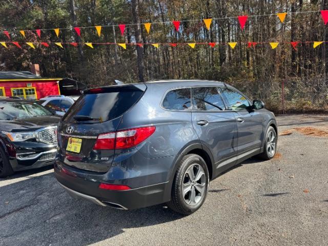 2016 Blue Hyundai Santa Fe SE AWD (KM8SMDHF4GU) with an 3.3L V6 DOHC 24V engine, 6-Speed Automatic transmission, located at 1806 Veterans Memorial Hwy SW, Austell, GA, 30168, (770) 944-9558, 33.817959, -84.606987 - Photo#2