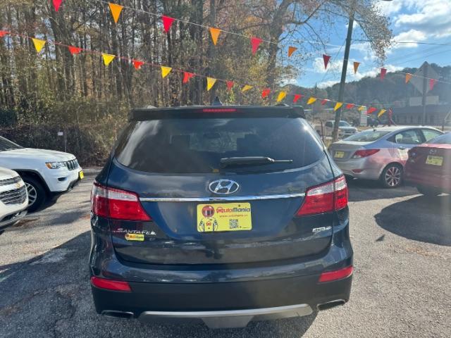 2016 Blue Hyundai Santa Fe SE AWD (KM8SMDHF4GU) with an 3.3L V6 DOHC 24V engine, 6-Speed Automatic transmission, located at 1806 Veterans Memorial Hwy SW, Austell, GA, 30168, (770) 944-9558, 33.817959, -84.606987 - Photo#3
