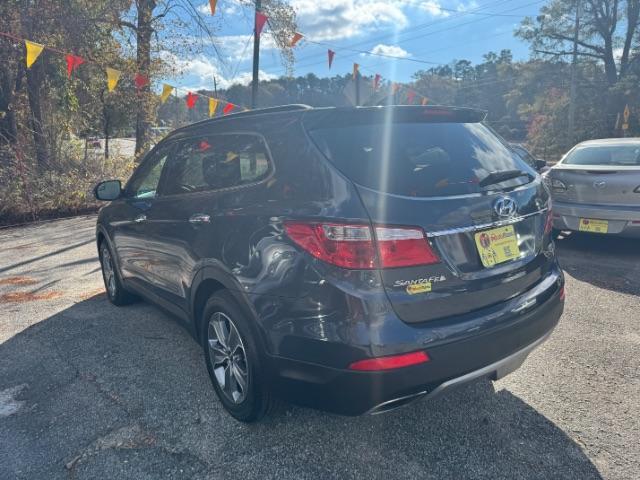 2016 Blue Hyundai Santa Fe SE AWD (KM8SMDHF4GU) with an 3.3L V6 DOHC 24V engine, 6-Speed Automatic transmission, located at 1806 Veterans Memorial Hwy SW, Austell, GA, 30168, (770) 944-9558, 33.817959, -84.606987 - Photo#4