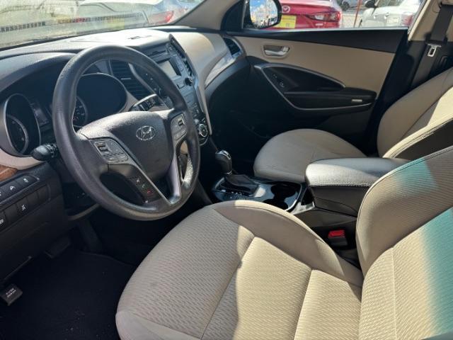 2016 Blue Hyundai Santa Fe SE AWD (KM8SMDHF4GU) with an 3.3L V6 DOHC 24V engine, 6-Speed Automatic transmission, located at 1806 Veterans Memorial Hwy SW, Austell, GA, 30168, (770) 944-9558, 33.817959, -84.606987 - Photo#5