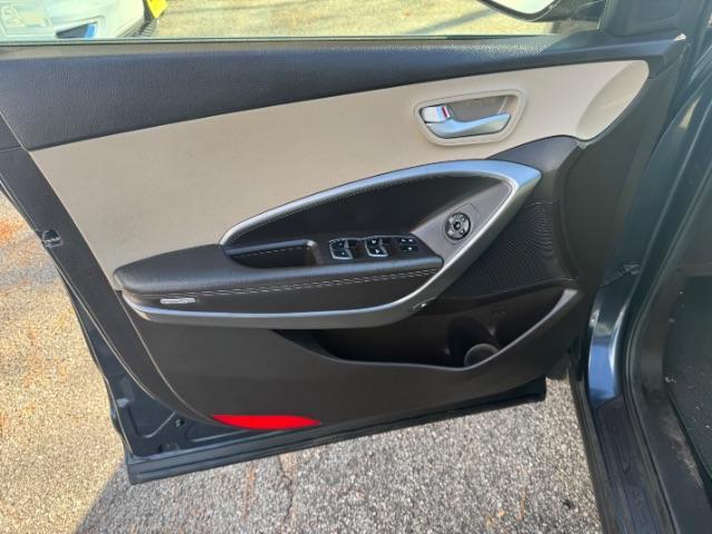 2016 Blue Hyundai Santa Fe SE AWD (KM8SMDHF4GU) with an 3.3L V6 DOHC 24V engine, 6-Speed Automatic transmission, located at 1806 Veterans Memorial Hwy SW, Austell, GA, 30168, (770) 944-9558, 33.817959, -84.606987 - Photo#6