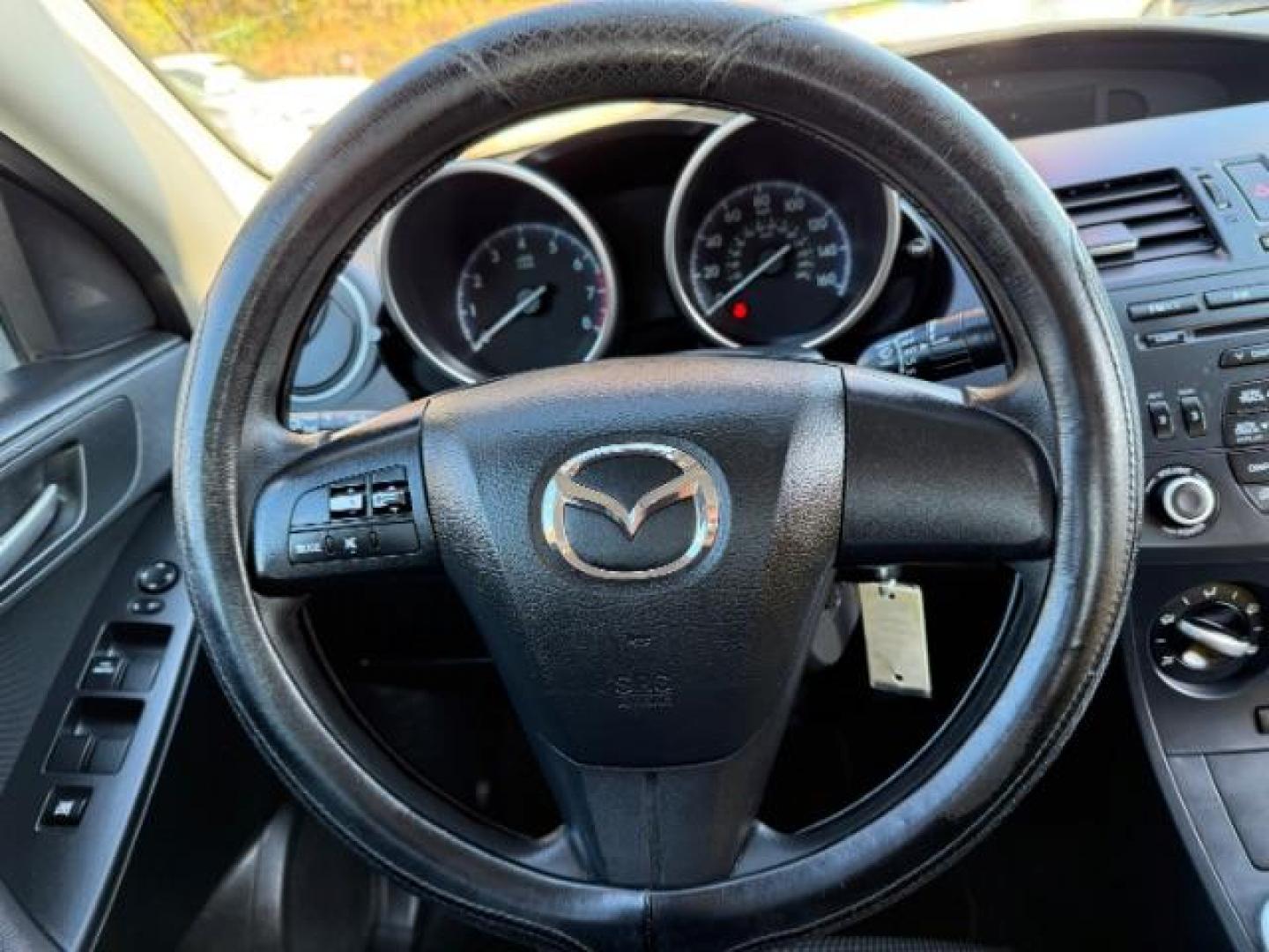 2013 Silver Mazda MAZDA3 i SV MT 4-Door (JM1BL1TF6D1) with an 2.0L L4 DOHC 16V engine, 5-Speed Manual transmission, located at 1806 Veterans Memorial Hwy SW, Austell, GA, 30168, (770) 944-9558, 33.817959, -84.606987 - Photo#9