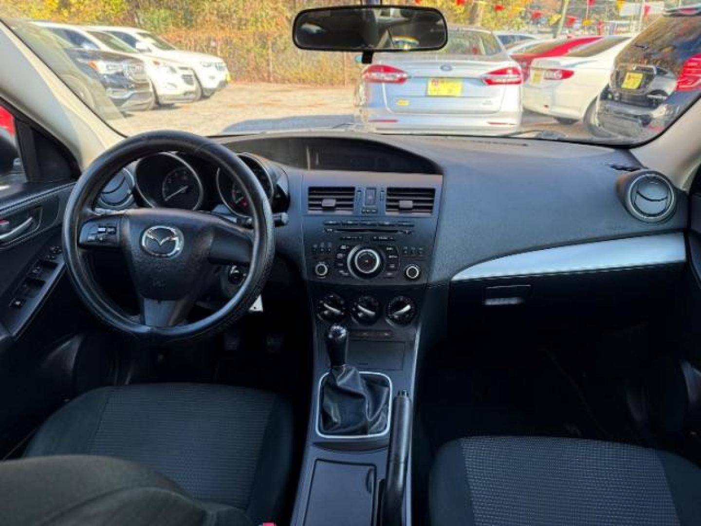 2013 Silver Mazda MAZDA3 i SV MT 4-Door (JM1BL1TF6D1) with an 2.0L L4 DOHC 16V engine, 5-Speed Manual transmission, located at 1806 Veterans Memorial Hwy SW, Austell, GA, 30168, (770) 944-9558, 33.817959, -84.606987 - Photo#11
